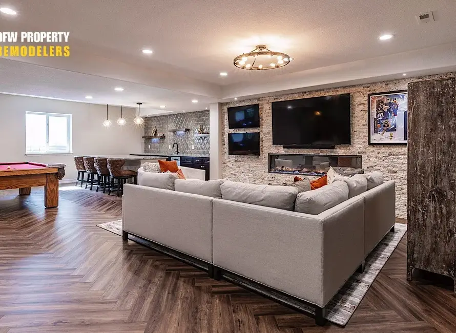 Basement Remodeling in Dallas featuring modern lounge, pool table, bar, and fireplace design.