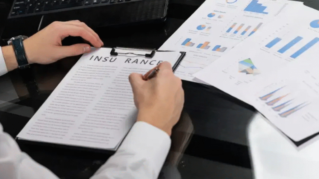 Hands reviewing insurance paperwork and charts, best remodeler in Dallas, TX service